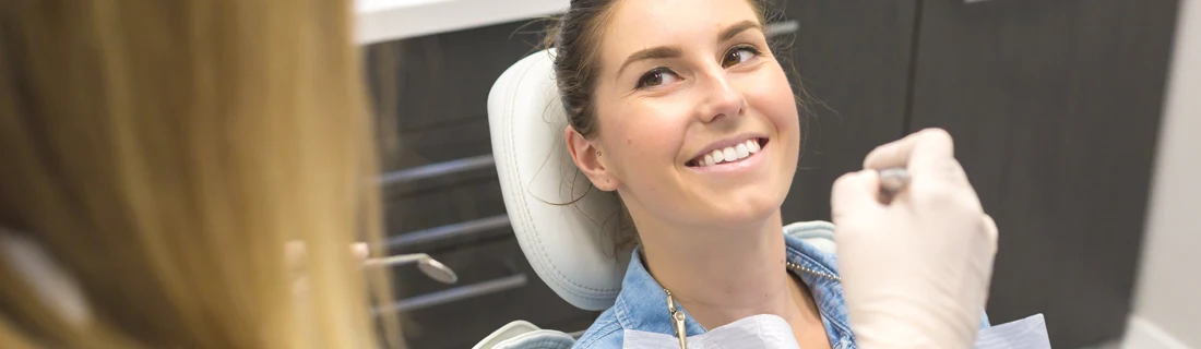 Dentist Orlando FL Dental Check-up Focused patient sitting in dentist chair receiving an oral check-up