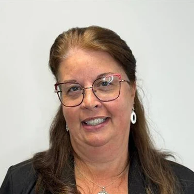 office manager Doreen Morone is seen with a welcoming smile on her face showcasing her biography