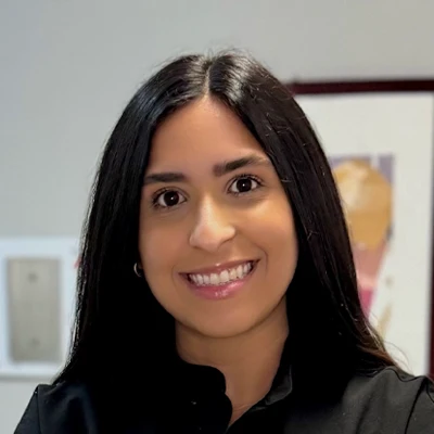 team member Valeria Pena is pictured smiling at the viewer inviting them to read her bio