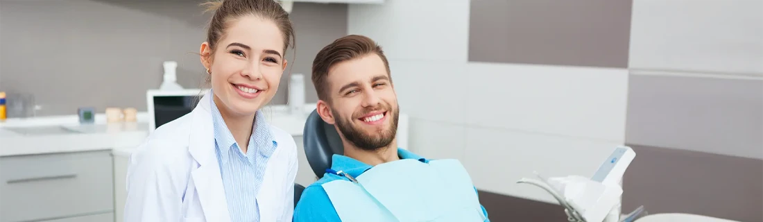 Dentist Orlando FL Dentist and Patient Smiling friendly female dentist preparing her patient for a check up